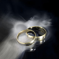 Image showing golden wedding rings and smoke