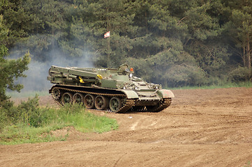 Image showing outdoor scenery with driving tank