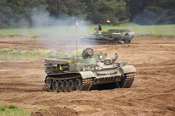 Image showing offroad scenery with driving tank