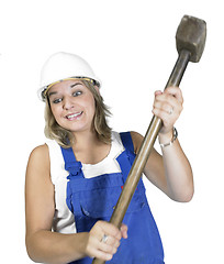 Image showing cute girl while hammering