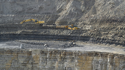 Image showing quarry digger and dump trucks