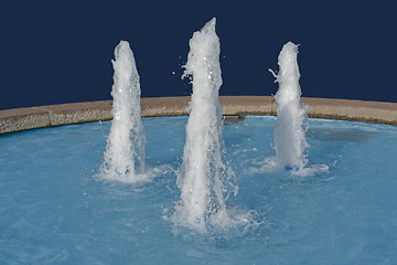 Image showing three fountains in blue back