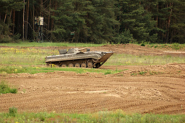 Image showing offroad scenery with driving tank