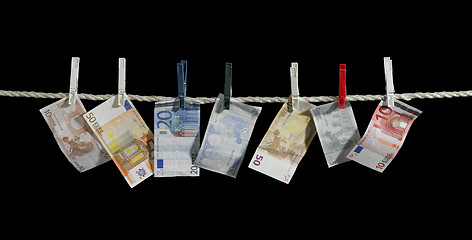 Image showing clothesline and money