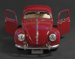 Image showing red model car front with open doors