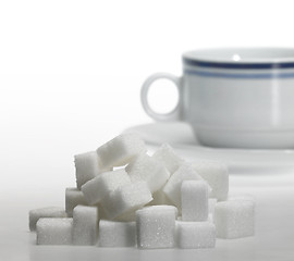 Image showing lump sugar and porcelain coffee cup