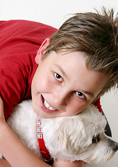 Image showing Young boy and a dog