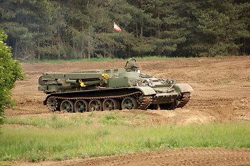 Image showing offroad scenery with driving tank