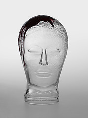 Image showing bloody glass head