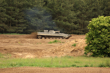 Image showing offroad scenery with driving tank