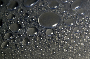 Image showing water beads in dark back