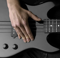 Image showing hand on bass guitar