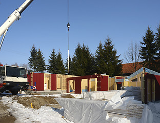 Image showing wooden house construction in sunny ambiance