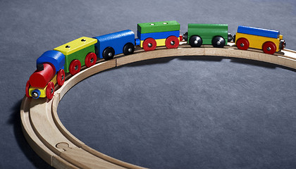 Image showing colorful wooden toy train on tracks