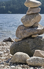 Image showing waterside scenery with pebble pile