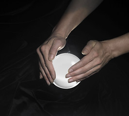 Image showing crystal ball and hands around