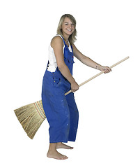 Image showing cute girl sitting on a besom