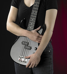 Image showing woman with bass guitar