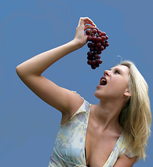 Image showing Girl eating Grapes