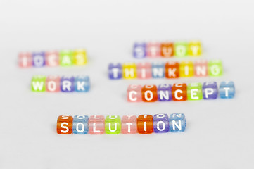 Image showing Text Solution on colorful cubes