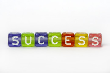 Image showing Text success on colorful wooden cubes