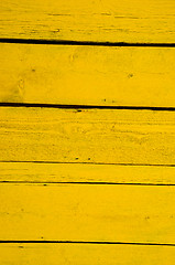 Image showing Wall made of yellow wooden planks. 