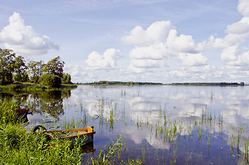 Image showing Summer lake landscape boats clouds reflections 