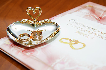 Image showing wedding rings and marriage certificate