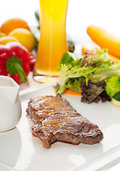 Image showing juicy BBQ grilled rib eye ,ribeye steak and vegetables