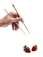 Image showing chopsticks and strawberries