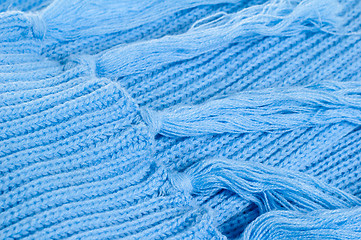 Image showing Blue knitted scarf, close up