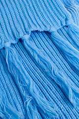 Image showing Blue knitted scarf, close up