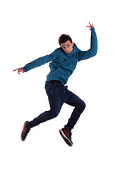 Image showing Portrait of a very happy young man, jumping with his arms  open