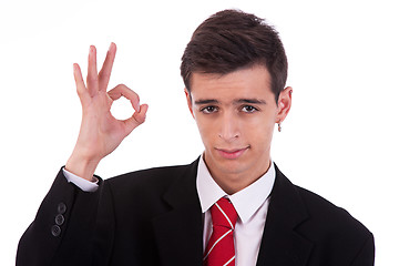 Image showing Portrait of a  happy young man, with thumbs raised as a sign of ok