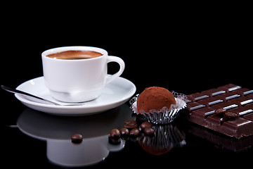 Image showing Coffee with chocolate - brigadier, on black with reflexion