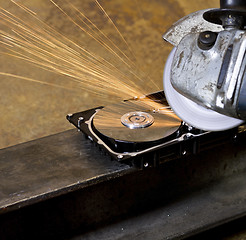 Image showing angular grinder cleaning data from hard drive