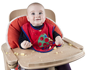 Image showing toddler eating potatoes