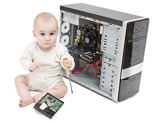 Image showing young child working on open computer