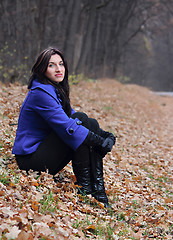 Image showing Young woman in the autumn park