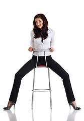 Image showing Girl sitting on the bar chair