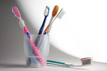 Image showing Toothbrushes in a glass