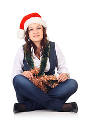 Image showing Girl in a santa hat with christmas decoration
