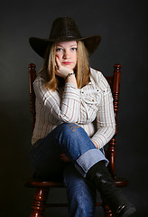 Image showing Girl sitting on a chair