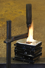 Image showing burning vise and hard disks