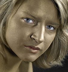Image showing golden face of a young woman