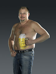 Image showing man with naked beer belly