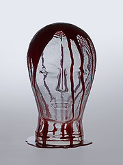 Image showing bloody glass head