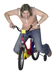 Image showing mad bicycling girl