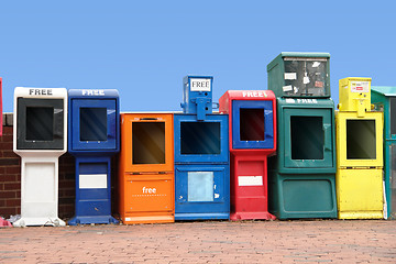Image showing various news racks in a row