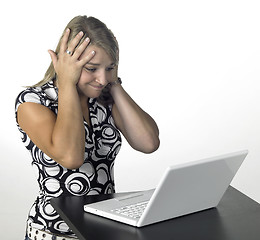 Image showing blonde computing girl - shit happens